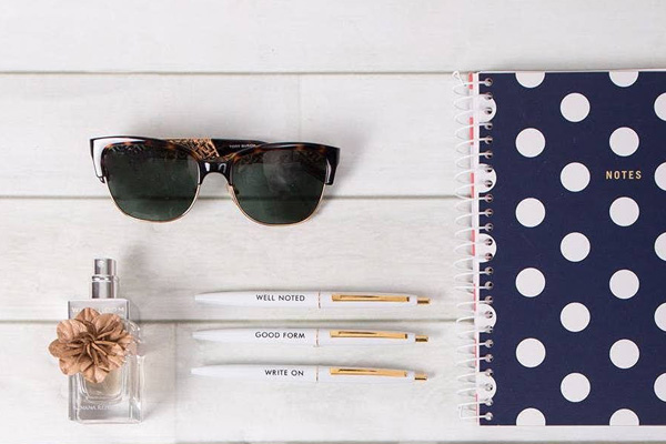 pen perfume sunglasses notepad